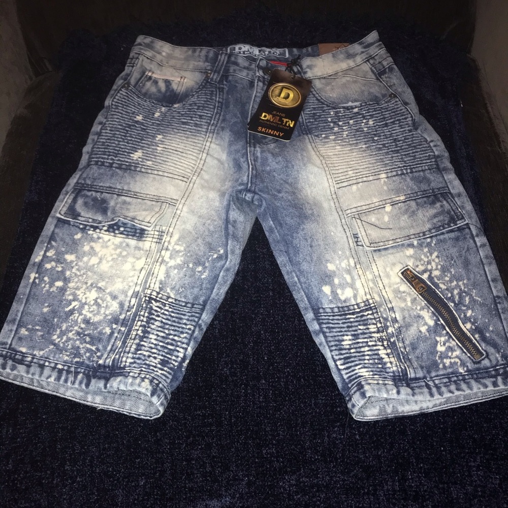 Men’s distressed jean shorts, w/ zippers.